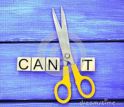 I can self motivation - cutting the letter t of the written word Stock Photo