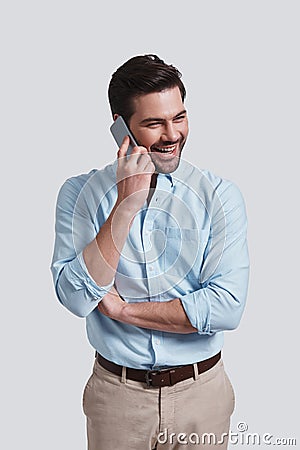 I can totally make it work. Good looking young man talking on s Stock Photo