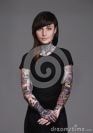 I collect memories on my skin. A cropped studio portrait of a beautiful tattooed young woman. Stock Photo