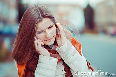 I do not hear you. Closeup portrait beautiful woman girl talking to the phone listening carefully trying to hear understand the Stock Photo
