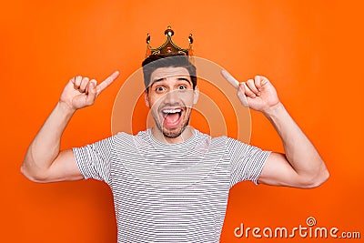 I don`t believe. Photo of cool excited guy good mood direct fingers head golden crown amazed prom king open mouth wear Stock Photo