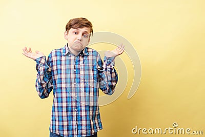 I don`t know. clueless boy lifts hands in dismay Stock Photo