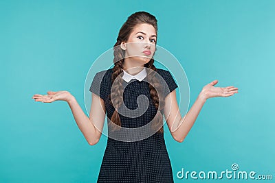 I don`t know. Confused cute girl looking up Stock Photo