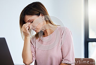 I dont think I can do today. a female manager experiencing a headache at work. Stock Photo