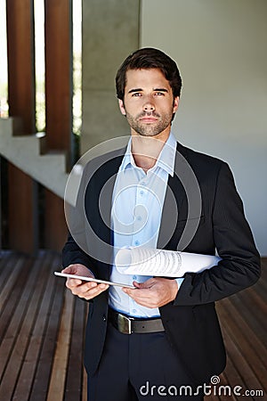 I am equipped and ready to start the day. A young employee equipped with the neccessary tools for doing business. Stock Photo