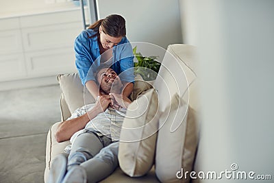 I get to be with the love of my life everyday. a young married couple spending the day at home. Stock Photo