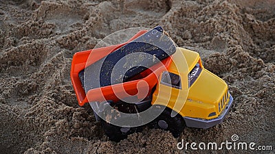 I grew up playing with the phone in the sand Stock Photo
