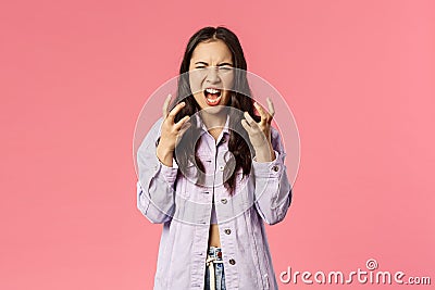 I hate all of you. Portrait of outraged, annoyed and angry young girl, teenage korean female screaming furious Stock Photo