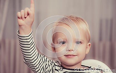 I have excellent idea. Boy cute toddler blue eyes pointing upwards index finger. Creative idea concept. Brilliant Stock Photo