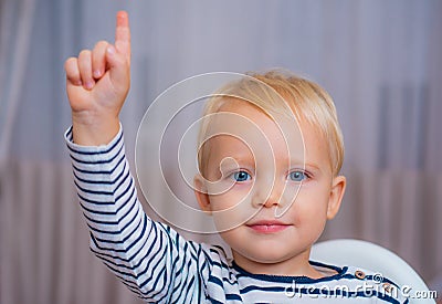 I have excellent idea. Boy cute toddler blue eyes pointing upwards index finger. Creative idea concept. Brilliant Stock Photo