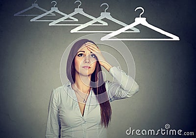 I have nothing to wear! Perplexed woman thinking what to dress Stock Photo