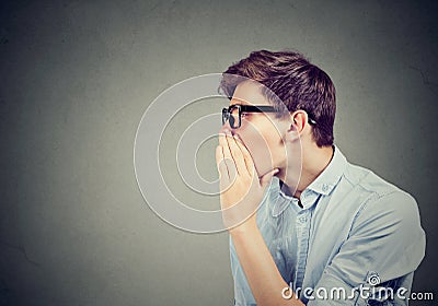 I have a secret to tell you. Man whispering a gossip Stock Photo