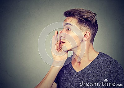 I have a secret to tell you. Man whispering a gossip Stock Photo