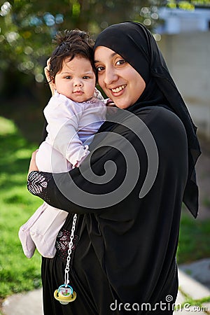 I just adore her. a muslim mother and her little baby girl. Stock Photo