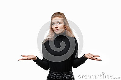 I just canT choose between the two. Puzzled young woman shrugs shoulders, standing troubled against white background Stock Photo