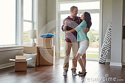 I just know were going to love it here...a young couple moving into their new home. Stock Photo