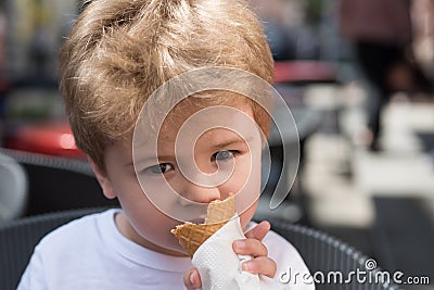 I just like getting a haircut. Small boy with stylish haircut. Little child eating outdoor. Little child with short Stock Photo
