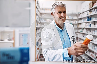 I know this treatment will act fast. a pharmacist working in a drugstore. Stock Photo