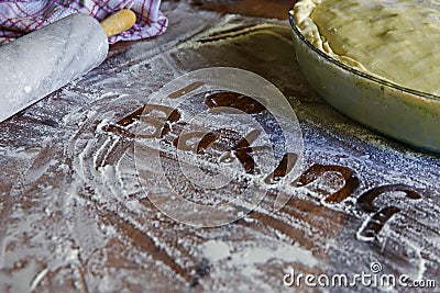 I love baking written into a flour dusted table Stock Photo