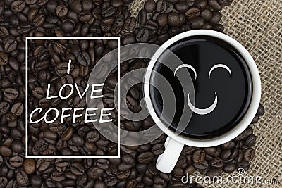 I love coffee text in coffee cup on coffee beans background Stock Photo