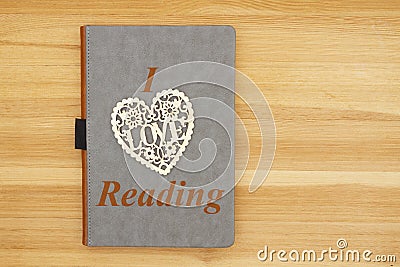 I love reading message with gray leather book with heart Stock Photo