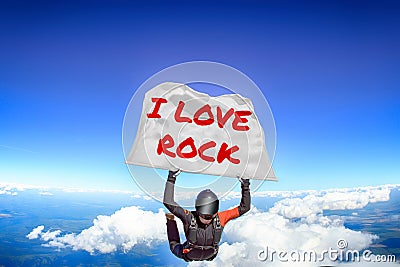 I love Rock. Flag in skydiving. People in free fall.Teampleat skydiver. Extreme sport. Stock Photo