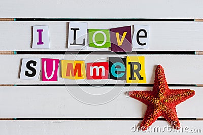 I Love Summer - written with color magazine letter clippings on wooden board. Travel concept Stock Photo
