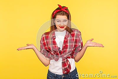 I`m confused, don`t know answer. Portrait of puzzled uncertain pinup girl raising hands in bewilderment having doubts Stock Photo