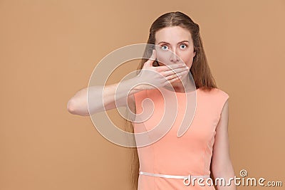 I`m silent. shocked woman covering her mouth. Stock Photo