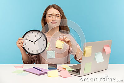 I need some break! Exhausted fatigued upset woman employee sitting at workplace office, all covered with sticky notes Stock Photo