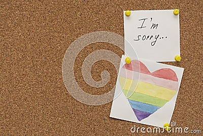 Apologize, I am sorry inscription text written on white paper pined on cork board Stock Photo