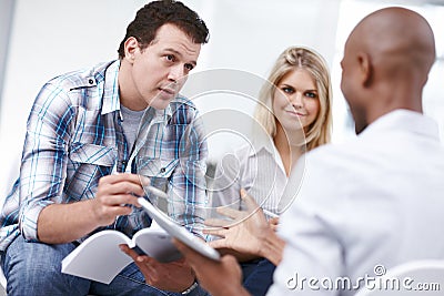 I think you should work on this aspect...Three design professionals busy having a work discussion. Stock Photo