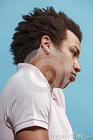 Beautiful bored afro man isolated on blue background Stock Photo