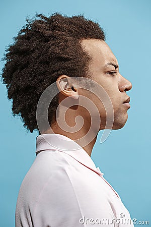 Beautiful bored afro man isolated on blue background Stock Photo