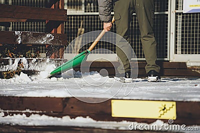 I took a picture of snow piled up and a person removing snow Stock Photo
