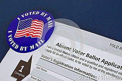 `I Voted By Mail` sticker and Absentee Voter Application Vote by Mail Form Stock Photo