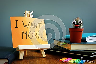 I want more sign on a workplace in the office Stock Photo