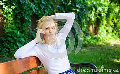 I was worrying about you. Girl modern smartphone calling friend cell phone. Girl blonde tense face talk smartphone green Stock Photo