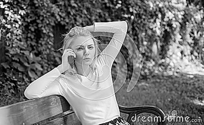 I was worrying about you. Girl modern smartphone calling friend cell phone. Girl blonde tense face talk smartphone green Stock Photo