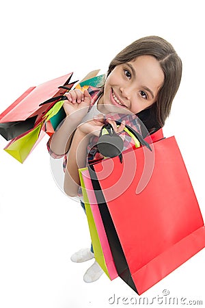 I will take it all. Kid girl happy smiling face carries bunch packages white background. Girl likes shopping on sale Stock Photo