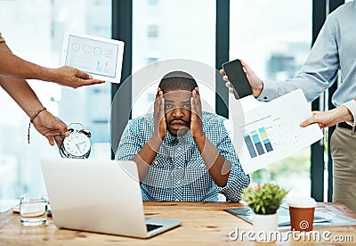 I wont be able to do this in time. a young businessman looking stressed out in a demanding office environment. Stock Photo