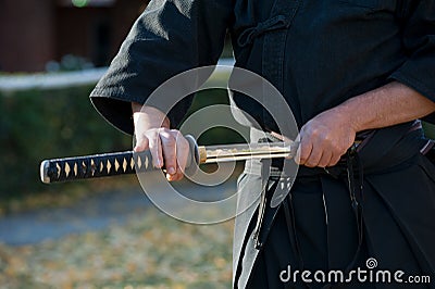 Iaido instructor draws his sword katana Stock Photo