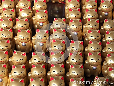Closeup of Maneki neko or lucky cats or beckoning cats or fortune cats Stock Photo