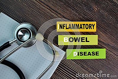 IBD - Inflammatory Bowel Disease write on sticky notes isolated on Wooden Table Stock Photo