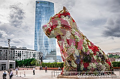 Iberdrola Tower and Puppy sculpture Editorial Stock Photo