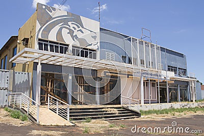 Ibitinga, SP, Brazil - Feb 09 2021: Facade of abandoned college building with wood barricade on the doors Editorial Stock Photo