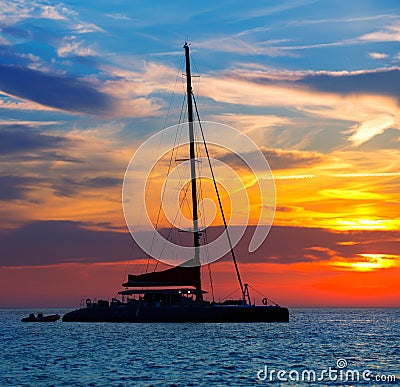 Ibiza san Antonio Abad catamaran sailboat sunset Stock Photo