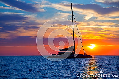 Ibiza san Antonio Abad catamaran sailboat sunset Stock Photo