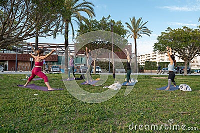 Yoga teacher teaching outdoor classes in Ibiza Editorial Stock Photo