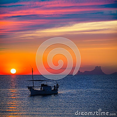 Ibiza sunset Es Vedra view and fisherboat formentera Stock Photo